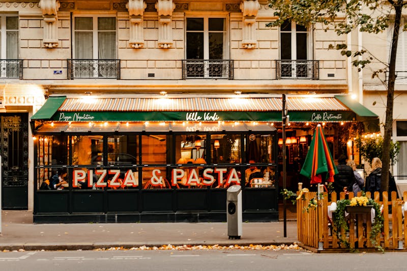 Dewey's Pizza kitchen team at work crafting handmade pizzas