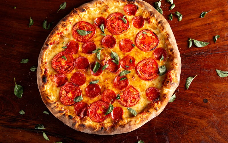 BBQ Chicken pizza with smoky sauce and red onion